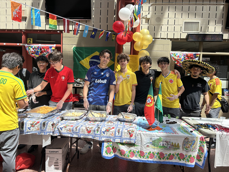 Photos of cultural food table set up by Brebeuf students, showcasing food from the cultural region and countries from that culture and region