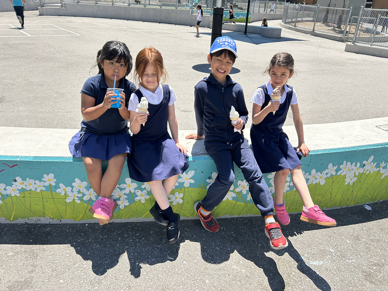 Photo of St. John Bosco students enjoying ice cream together
