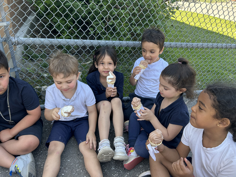 Photo of St. John Bosco students enjoying ice cream together