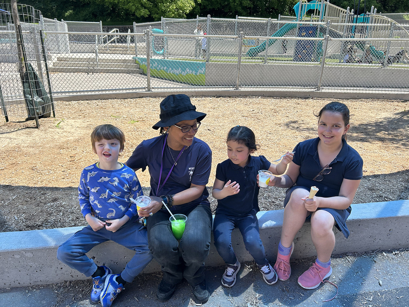 Photo of St. John Bosco students enjoying ice cream together