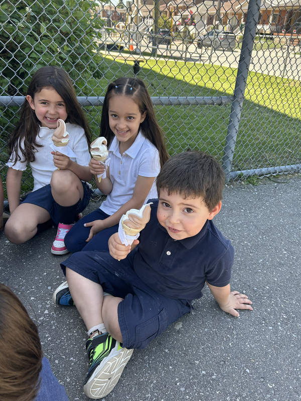 Photo of St. John Bosco students enjoying ice cream together