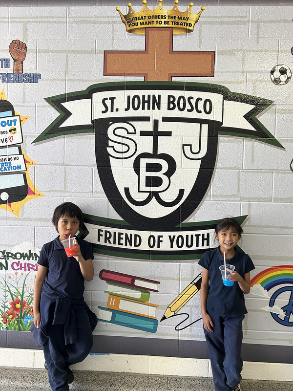 Photo of St. John Bosco students enjoying ice cream together
