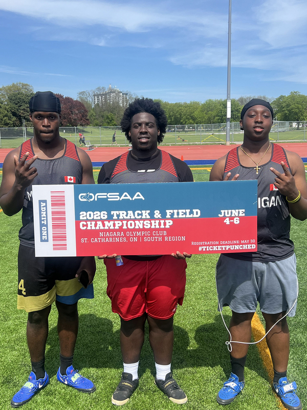 Photo of JCM athlete on the field holding up OFSAA ticket