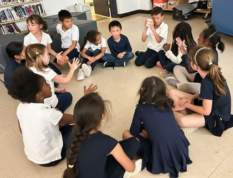 Photo of students doing an activity in a circle