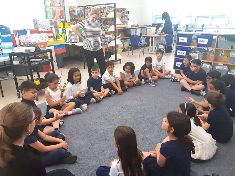 Photo of students doing an activity in a circle