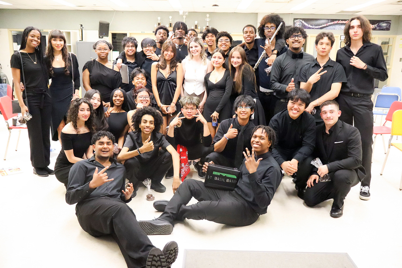 Group photo of the performing music students with their formal performing outfits
