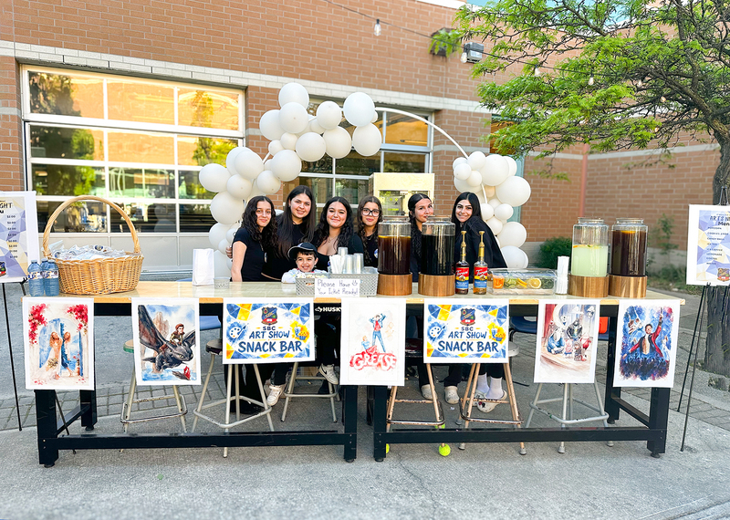 Photo of students running the snack bar at the showcase