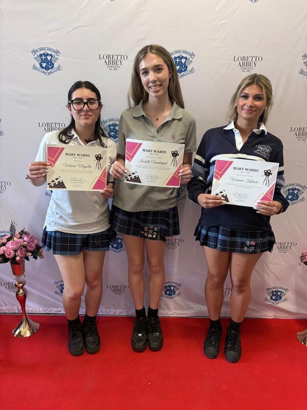 Photo of the award winners with their certificates