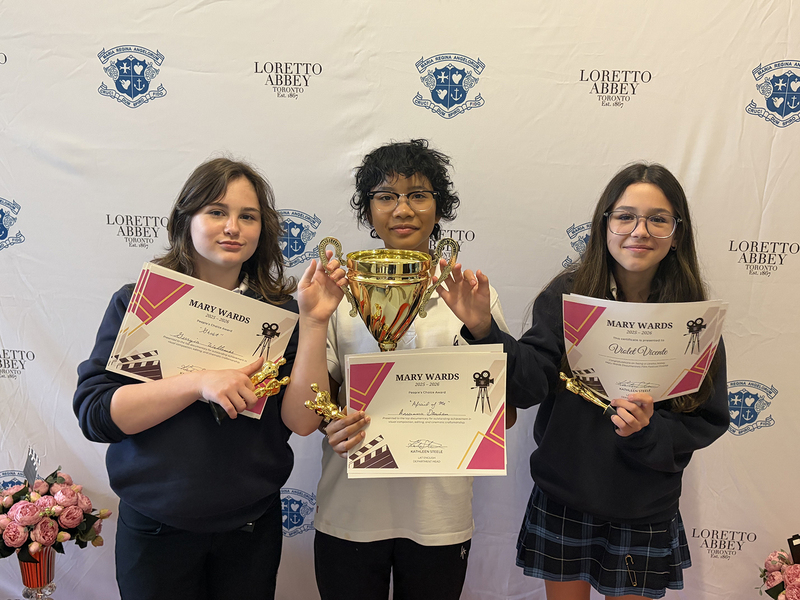 Photo of the award winners with their certificates