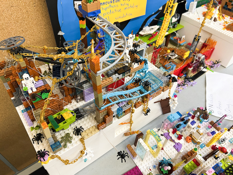 Photo of students exploring a lego exhibit at the festival