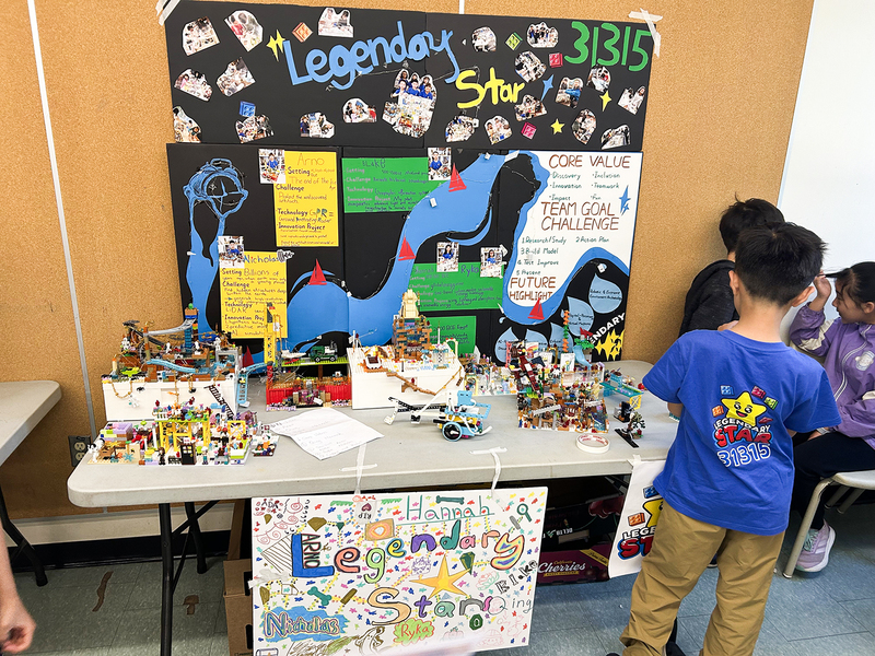 Photo of students exploring a lego exhibit at the festival