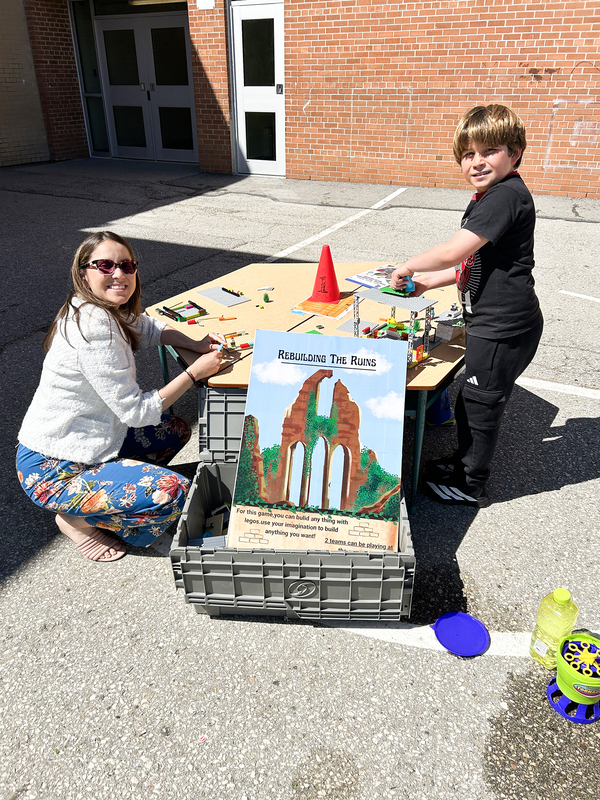 Photo of students and staff exploring a lego exhibit at the festival
