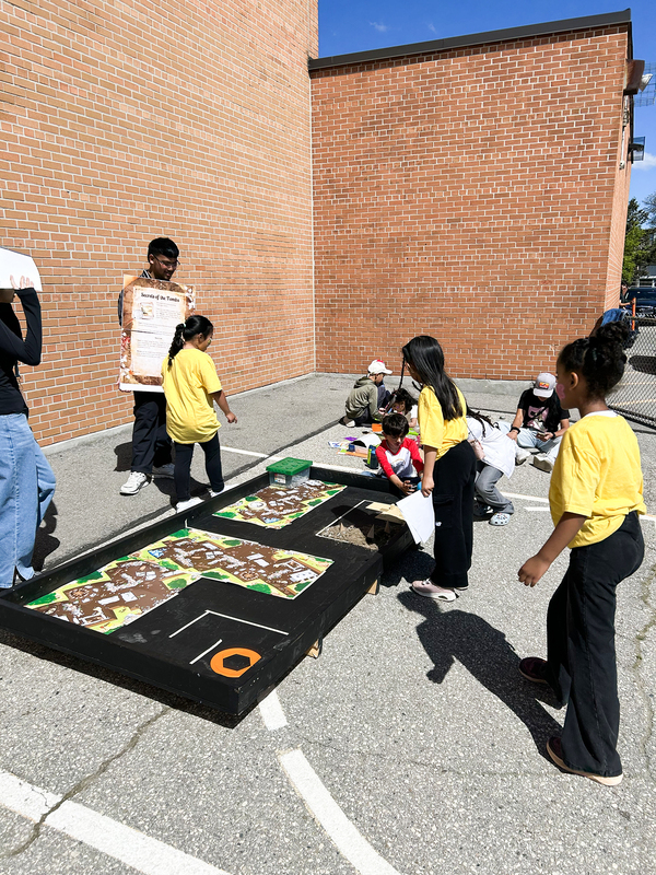 Photo of students exploring a lego exhibit at the festival