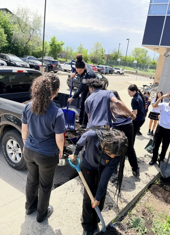 Photo of MPJ students working in the garden