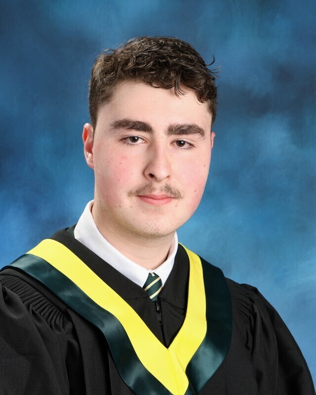 School photo of Gabriel in his graduating robes