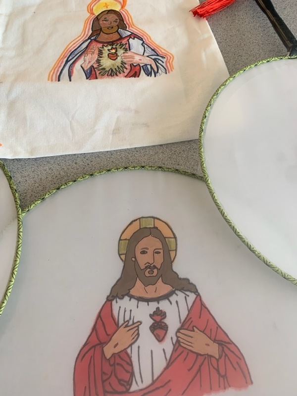 Photo of fans and totebags with images of Jesus made by the students as keepsakes