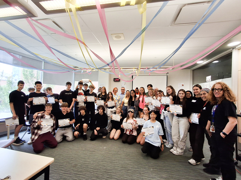Group photo of attendees to the Newcomer Orientation Week program, including students and staff
