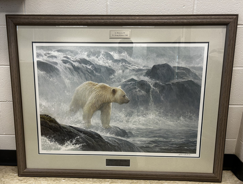 Photo of the painting donated to the school, showing a Polar bear navigating rocky waters