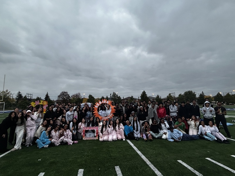 Father Henry Carr Grade 12 students gather together at sunrise