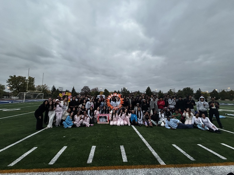 Father Henry Carr Grade 12 students gather together at sunrise