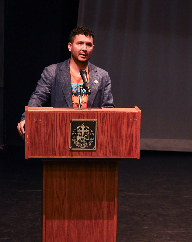 Photo of Jason at the podium speaking to the Redmond students