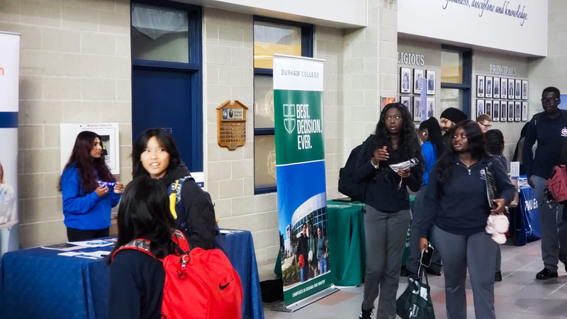 Father Henry Carr students mingling and checking out the booths at the fair