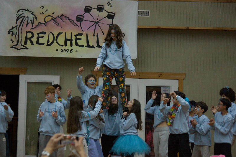 Photo of a group of students doing a performance during a group activity at Camp Muskoka