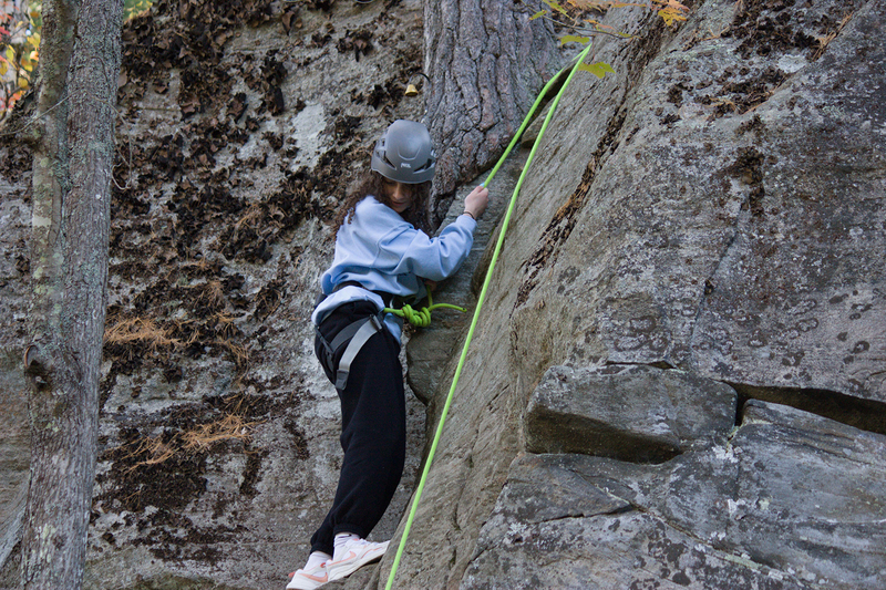 Photo of a student doing climbing at Camp Muskoka in proper gear
