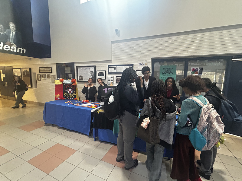 Photo of FHC students attending and exploring the various Club tables at the presentation