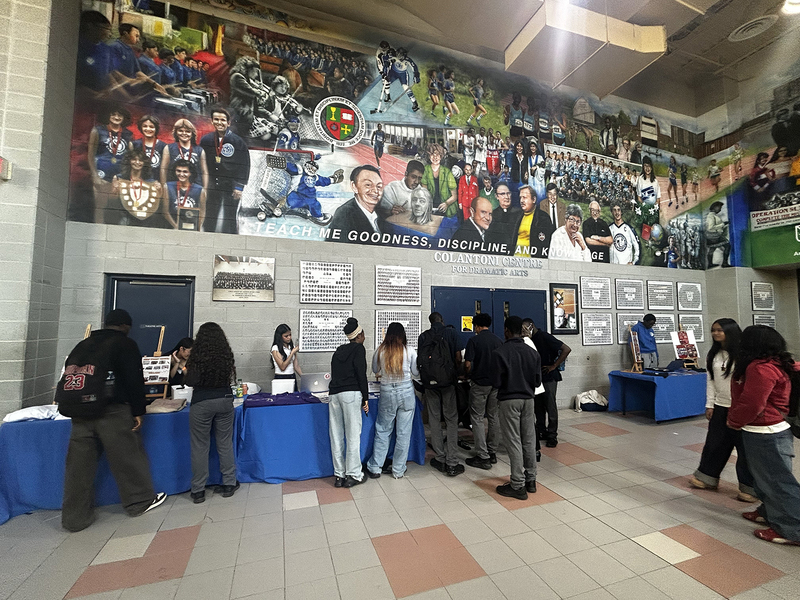 Photo of FHC students attending and exploring the various Club tables at the presentation