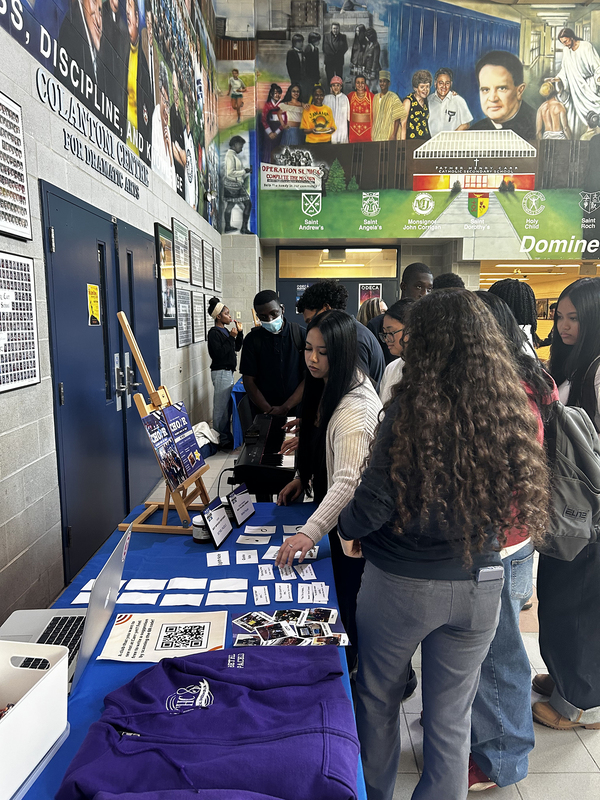 Photo of FHC students attending and exploring the various Club tables at the presentation
