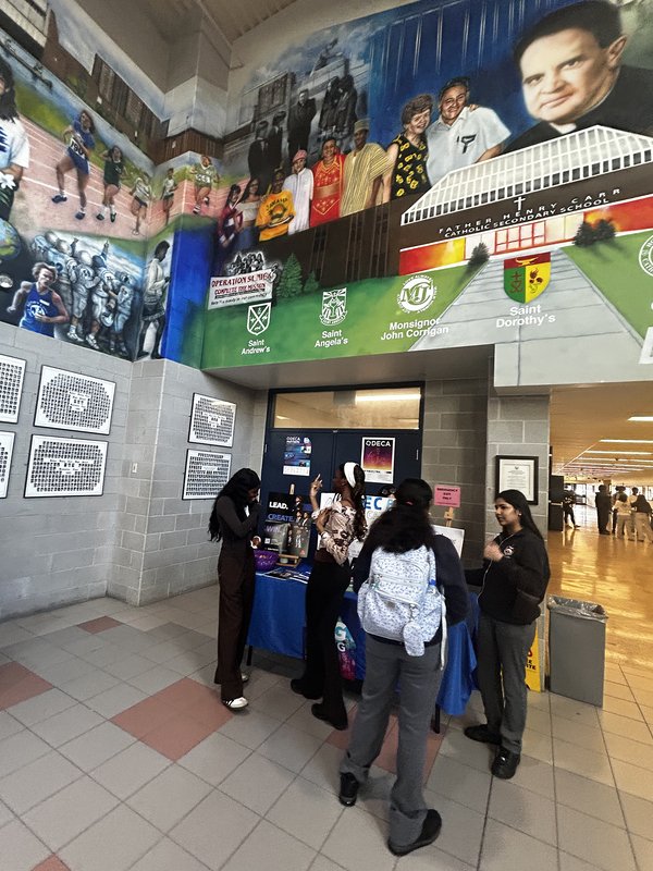 Photo of FHC students attending and exploring the various Club tables at the presentation