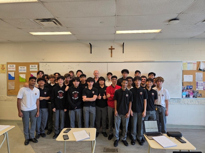 A group photo of boys in a classroom