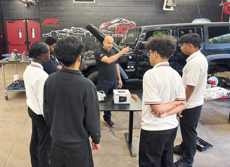 Photo of Sidd talking to students in the JCM transportation program