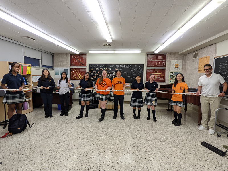 Group photo of SJCS students holding their flutes