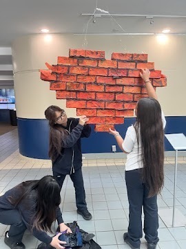 Photo of Cardinal Carter students working on the art intsallation