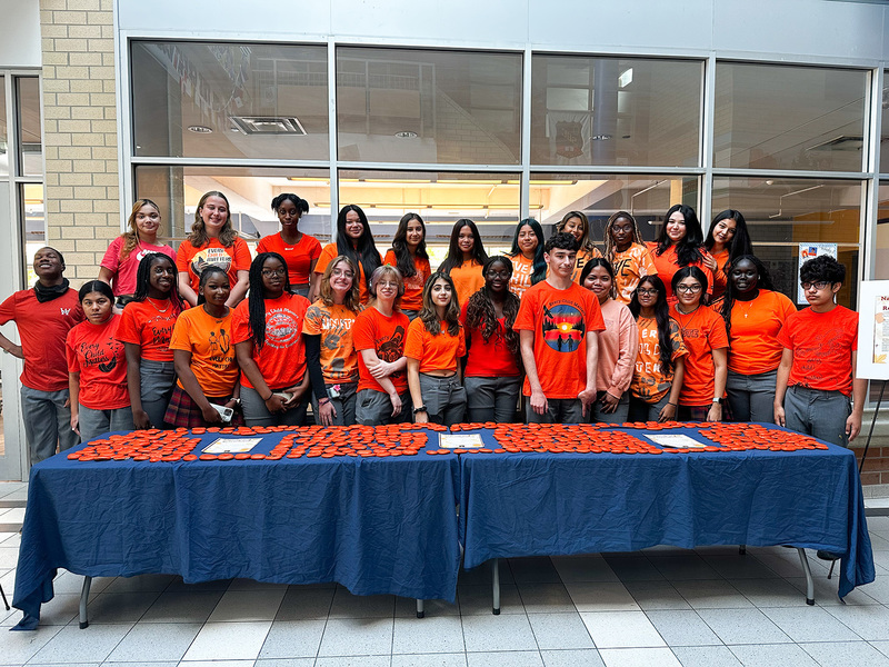 Group photo of St. Basil-the-Great students with the rocks they painted