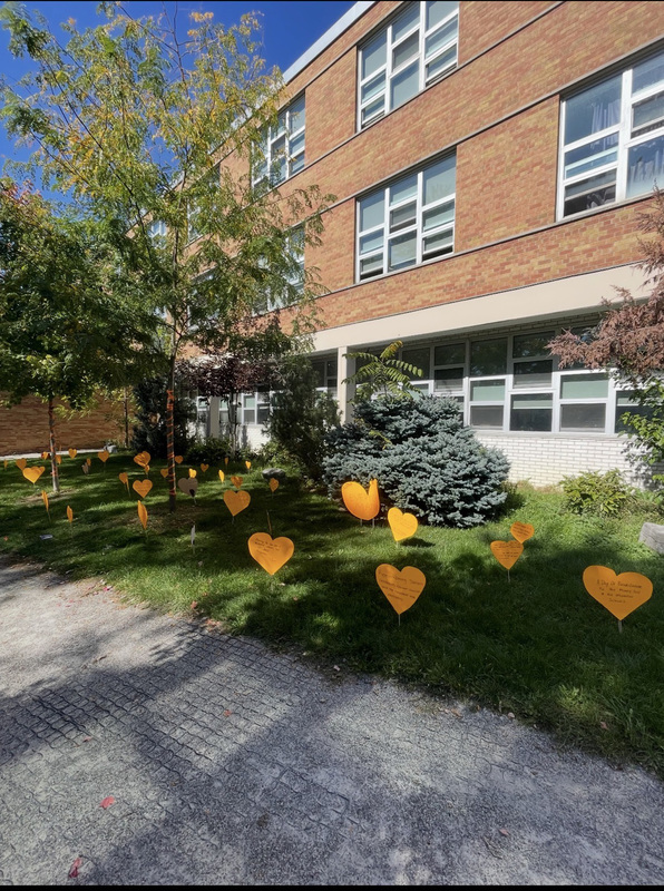 Photo of orange hearts on the school grounds