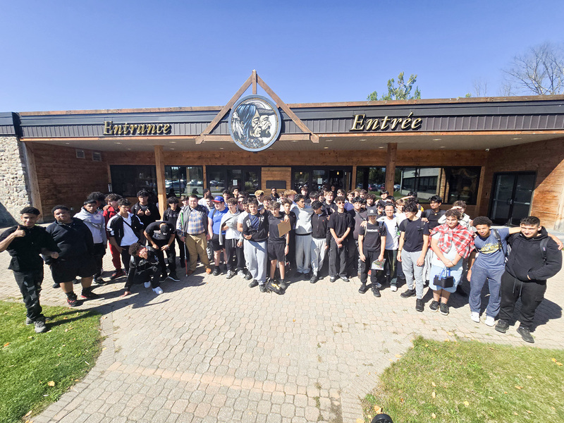Group photo of Chaminade Students in front of the entrance