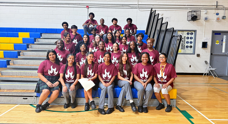 Group photo of St. Mother Teresa Catholic Academy's SLICE (Student Leaders in Catholic Education) Committee wearing their committee shirts