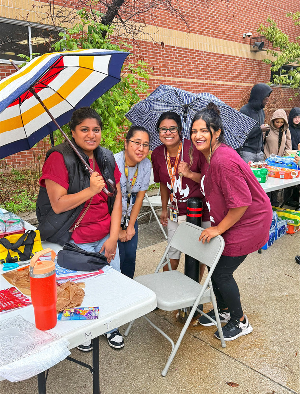 Group photo of St. Mother Teresa Catholic Academy staff during the BBQ