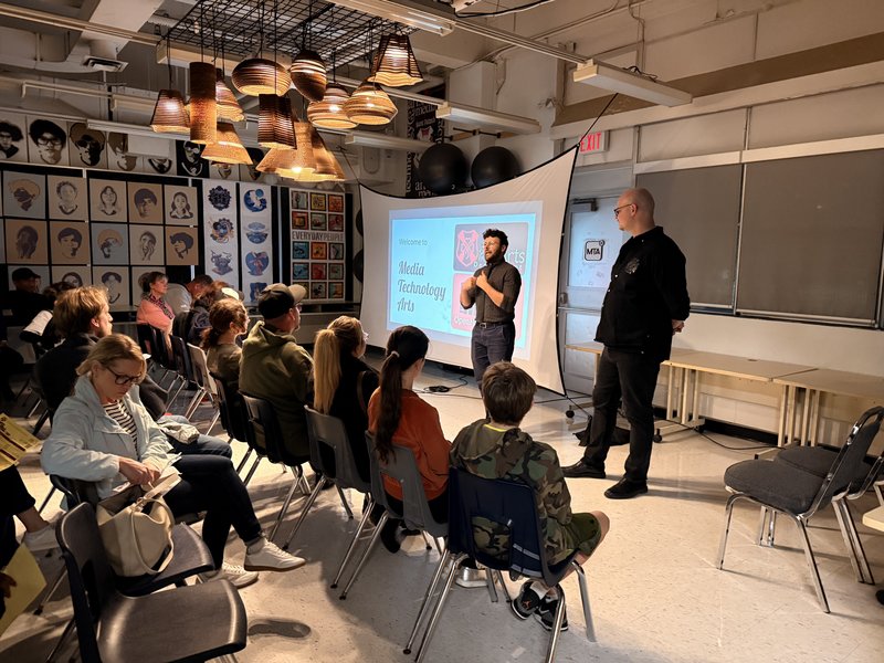 Attendees listen to Media Arts Technology presentationat St. Patrick CSS Open House 2025