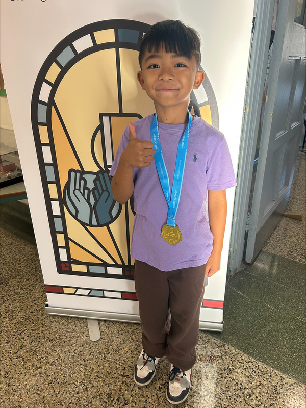 Photo of St. Margaret student dressed in purple for Dress Purple Day
