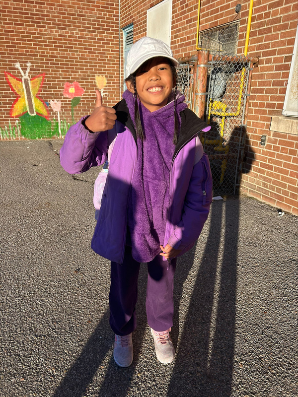 Photo of St. Margaret student dressed in purple for Dress Purple Day