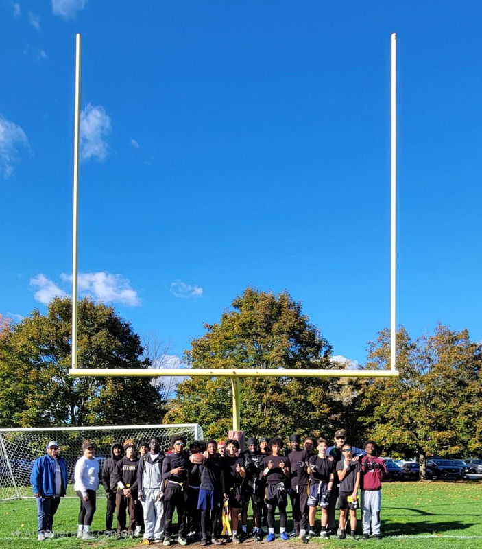 Group photo of St. John Paul II Catholic Secondary School's Senior Boys Flag Football team on the field