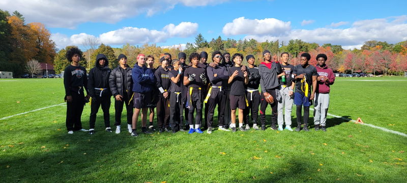 Group photo of St. John Paul II Catholic Secondary School's Senior Boys Flag Football team on the field