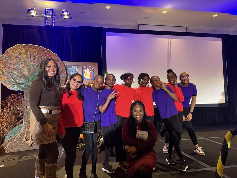 A group of students posing with faculty.