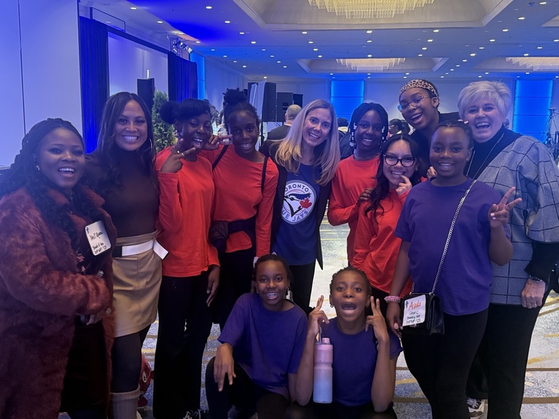 A group of students posing with faculty.