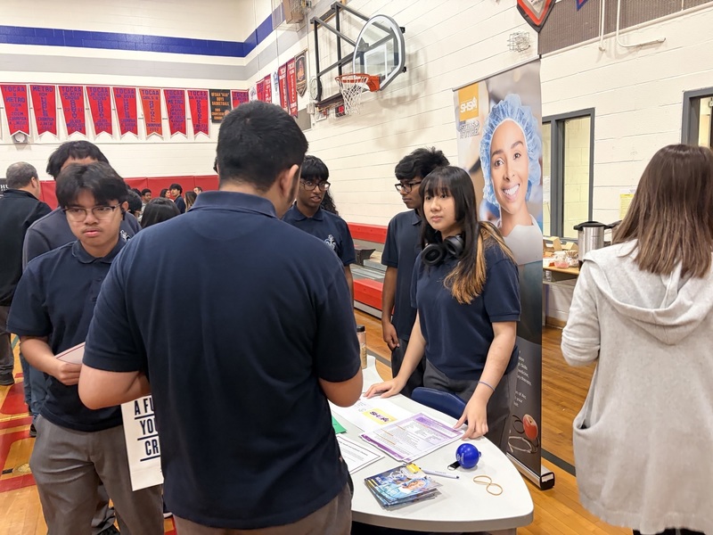 Students engaging with community partners and exploring post-secondary pathways during the event.