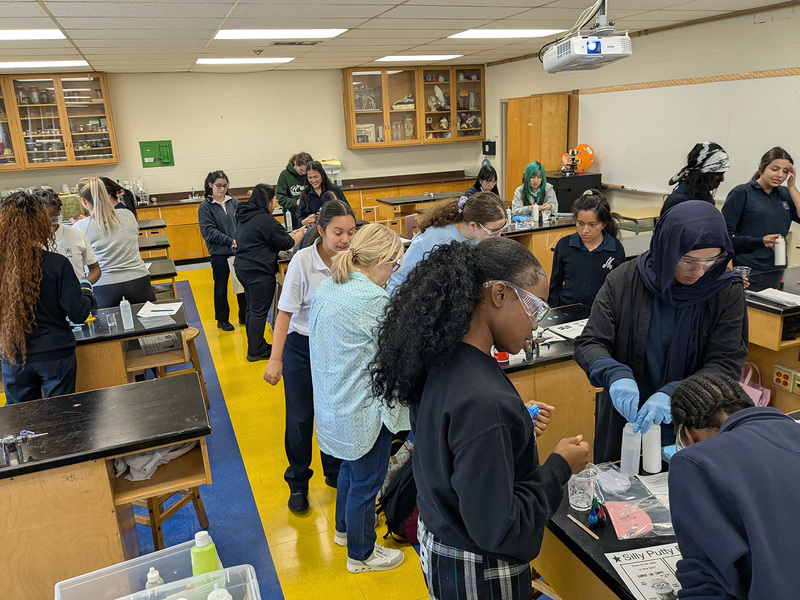 Photo of Madonna students working together to make silly putty